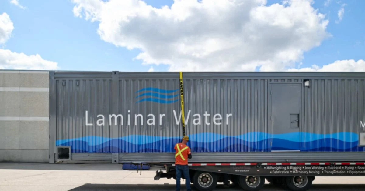 Technician securing Laminar Water treatment container for transport